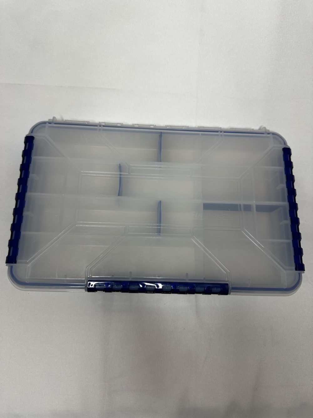 Multi-Compartment Clear Plastic Storage Box with Blue Accents.